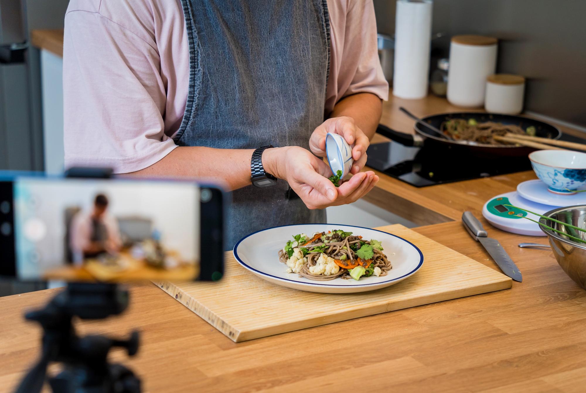 Mentor reviewing a trainee's dish